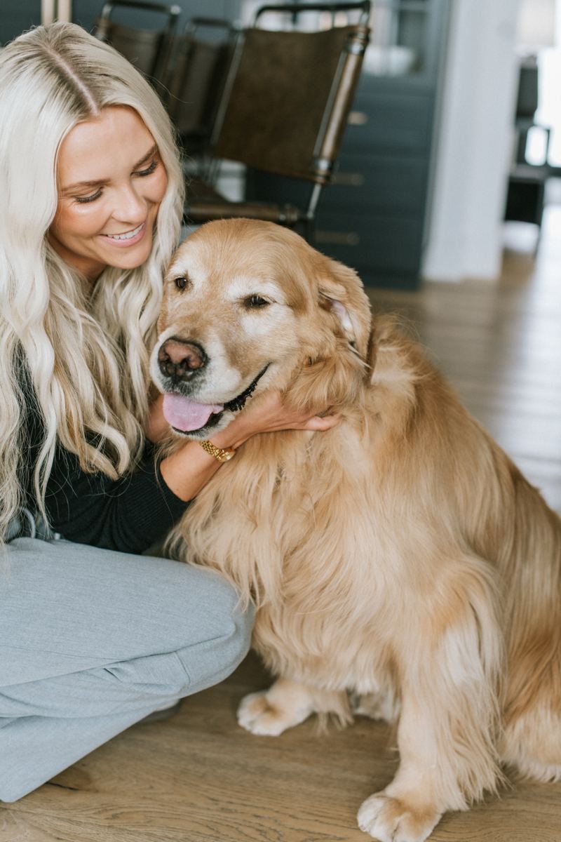 A resident with her golden retriever